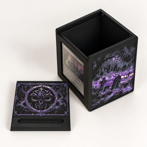 Open black Commander deck box showing the internal card storage compartment and original purple artwork