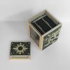 Open white Commander deck box showing the internal card storage compartment and original gold artwork
